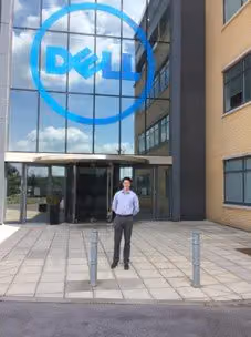 Practitioner standing outside the entrance of the Dell office building